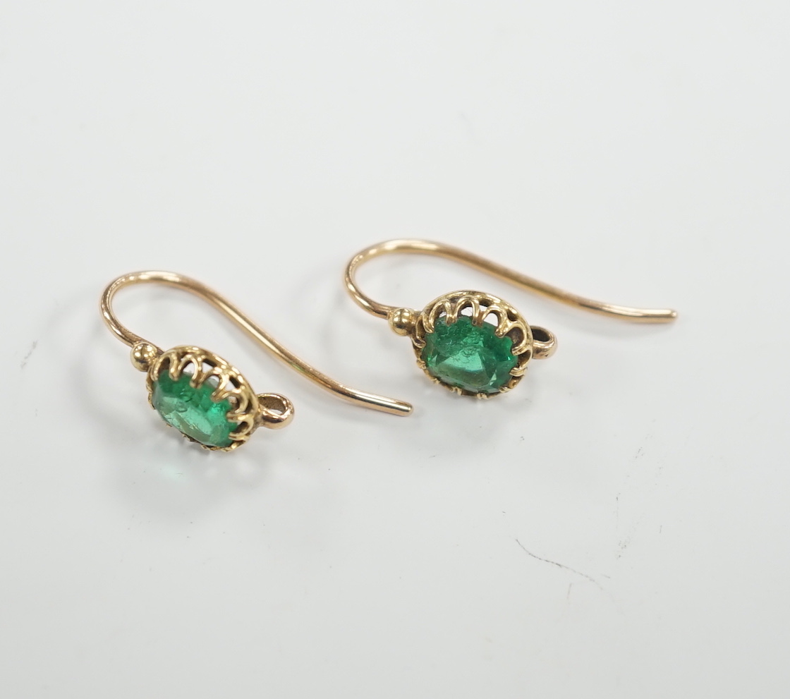 A pair of Victorian yellow metal and emerald set earrings (lacking drops), 6mm diameter, gross weight 2.5 grams